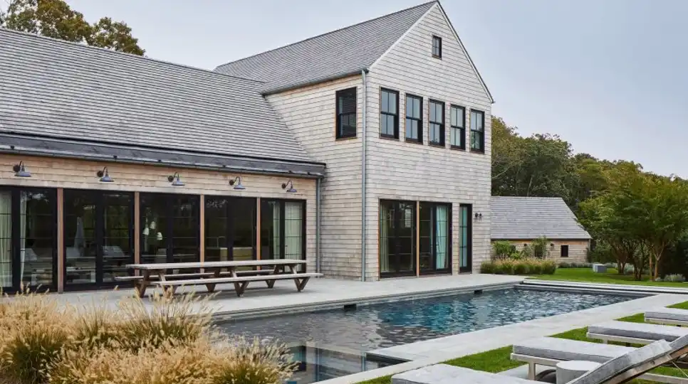 Amagansett Beach 3 with Hamptons-inspired interiors, including barn beams and cedar shingles.