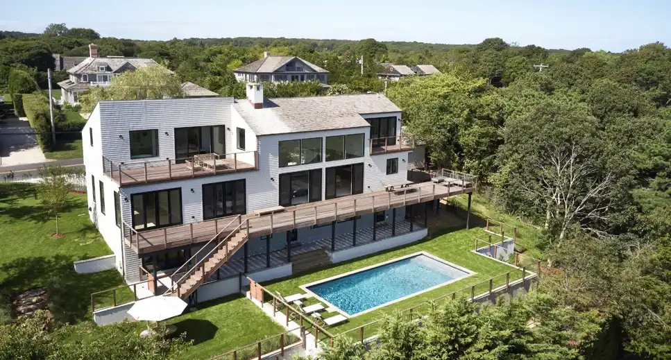 Atelier 211 with bold Hamptons-inspired interiors featuring dramatic A-frame architecture.
