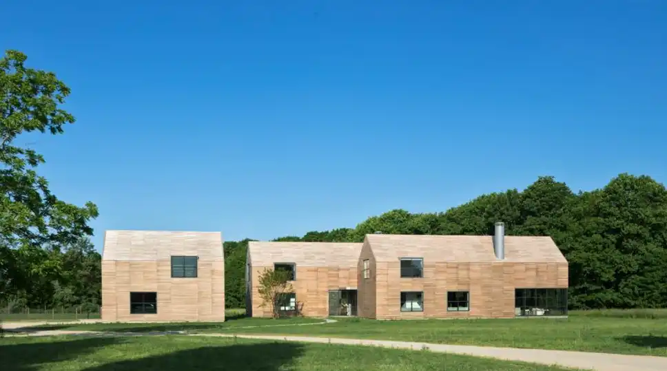 Grove House featuring Hamptons-inspired interiors with vaulted ceilings and floor-to-ceiling windows.