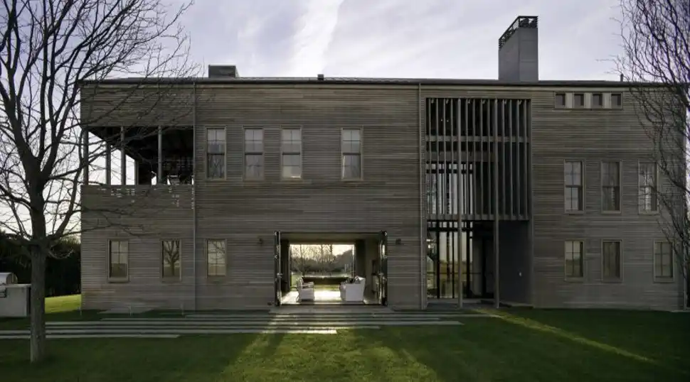 Louver House showcasing Hamptons-inspired interiors with timber framing and slatted teak facades.